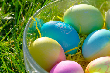 Fototapeta na wymiar Bowl of Easter Eggs / A bowl of Easter eggs with colorful art and bunny paintings.
