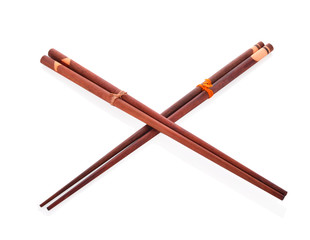 Wooden chopsticks on white background.