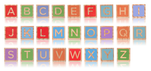 Wooden alphabet blocks with reflection isolated on white backgro