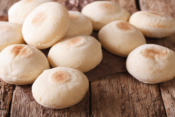 Traditional Moroccan batbout tiny bread close-up. horizontal
