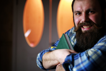 man bearded read book