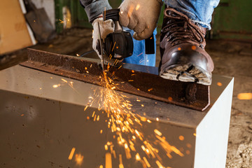 Worker working of a grinding machine
