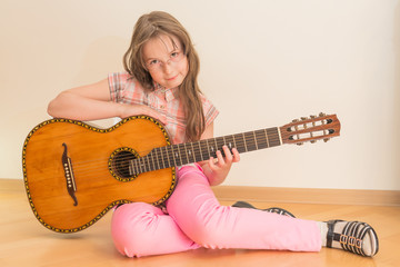 Fototapeta premium Girl with russian seven-string acoustic guitar