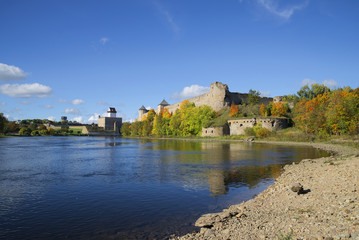 Sunny september day on the river Narova. View of the Ivangorod fortress and the castle of Hermann