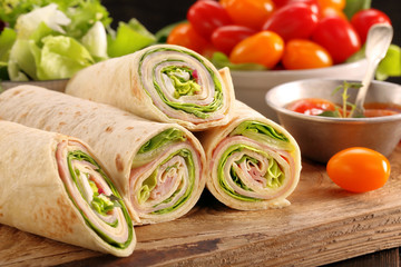 Fresh tortilla wraps with ham cheese and vegetables - 107040425