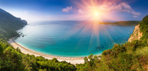 Panoramic landscape of the rocky coastline sea and Jaz Beach at sunshine. Montenegro. - obrazy, fototapety, plakaty