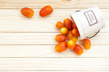 Small red tomatoes in cask