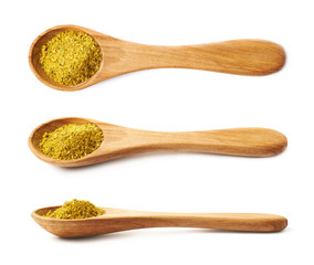 Wooden spoon of curry isolated