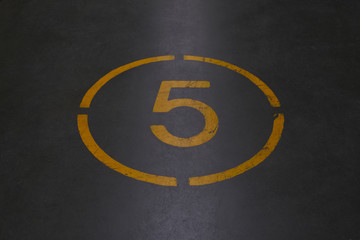 Fototapeta premium Number five is written with yellow paint