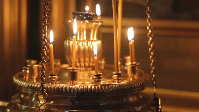burning candles in the Church lampstands