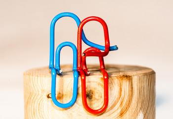 Colorful paperclips on unfocused background