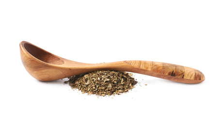 Wooden spoon and dried basil