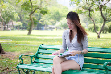 Portrait of thai adult beautiful girl read a book
