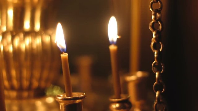 burning candles in the Church lampstands