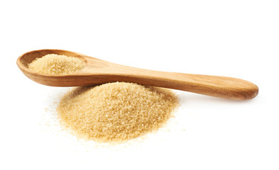 Spoon over pile of sugar