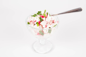 Cottage cheese with radish and chives in a cup