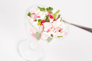 Cottage cheese with radish and chives in a cup