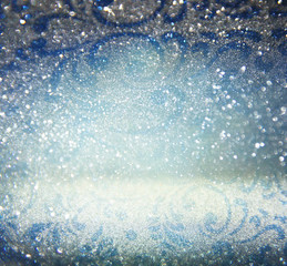 glitter vintage lights background. blue, silver and black. defocused.

