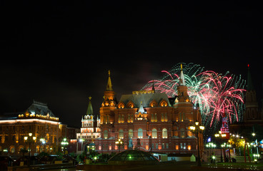 Fototapeta na wymiar Festive fireworks against the Historical museum, Moscow