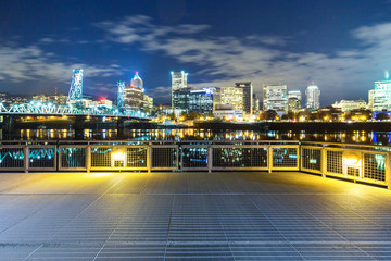 empty steel floor with cityscape and skyline of portland at nigh