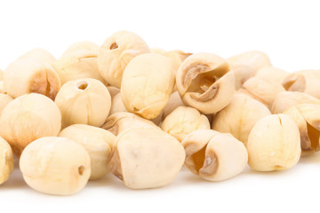 Dried lotus seeds on white background