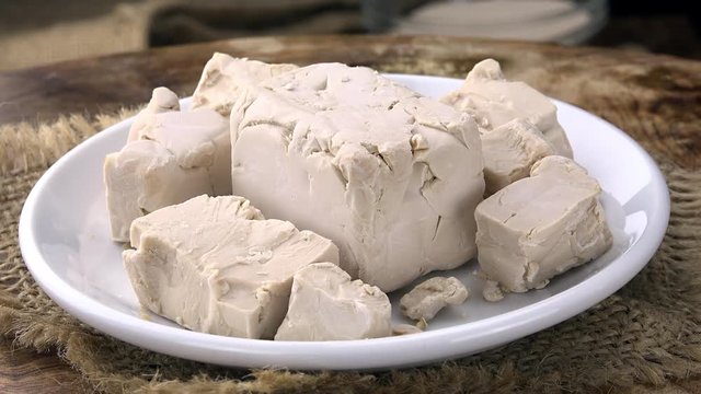 Portion of fresh rotating Yeast as seamless loopable 4K UHD footage