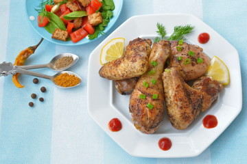 Roast chicken with slices of lemon and spices