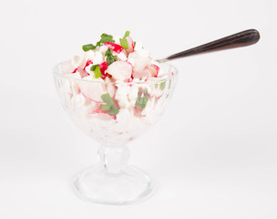 Cottage cheese with radish and chives in a cup