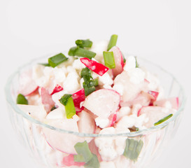 Cottage cheese with radish and chives in a cup