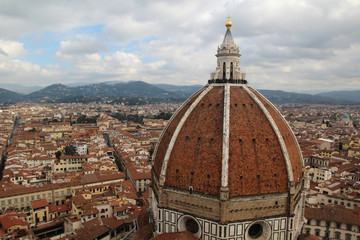Fototapeta na wymiar View of the cupola of Il Duomo Cathedral from Campanile tower, Florence