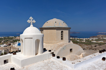 Church in Pyrgos Kallistis and Panoramic view to Santorini island, Thira, Cyclades, Greece