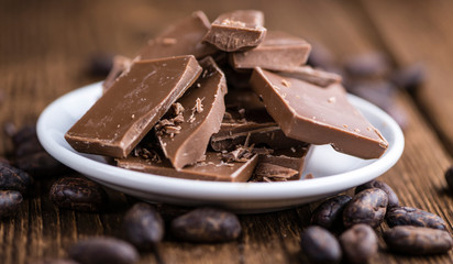 Milk Chocolate on wooden background