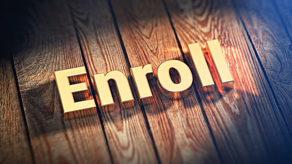 Word Enroll on wood planks