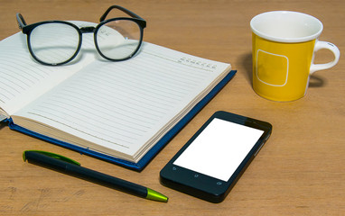 close up of office desk with stationery