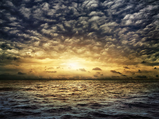 Naklejka na ściany i meble dark stormy sea with a dramatic cloudy sky
