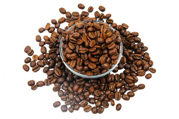 Heap of coffee beans around and within glass bowl