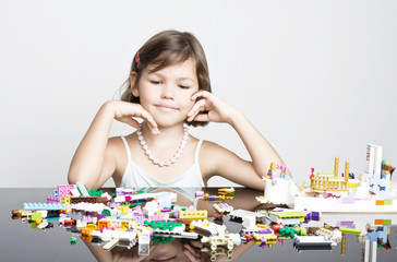 Little girl playing in Bricks
