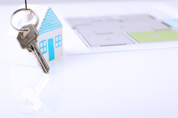 The small  house with a key.  The plan of a flat behind