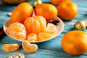 Ripe mandarins on a blue wooden table