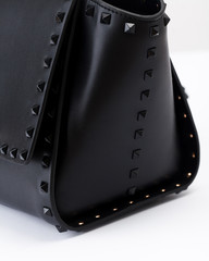 The black leather handbag