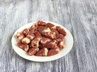 Chicken offal. Closeup of fresh raw chicken hearts.