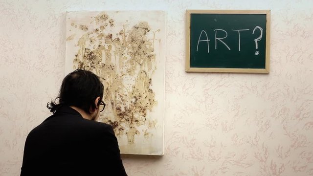 A critic at an art exhibition choosing between an abstract painting and a valueless frame, taking the frame. Funny scene.