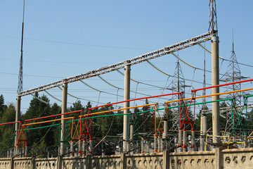 Electrical power high voltage substation encircled with barbed wire fence