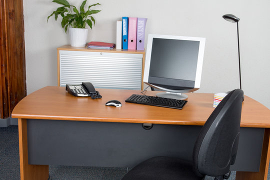Modern office monitor on the desk with nobody