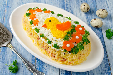 Festive salad Egg decorated with a chick and vegetables