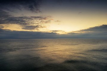 Beautiful vibrant sunrise landscape over calm sea