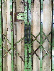An old green iron door