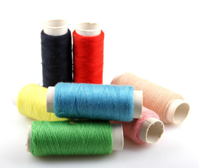 sewing threads on white background