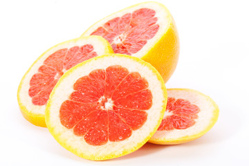 slices of  grapefruit on white background