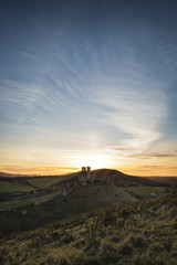 Naklejka na ściany i meble Landscape image of beautiful fairytale castle ruins during beaut